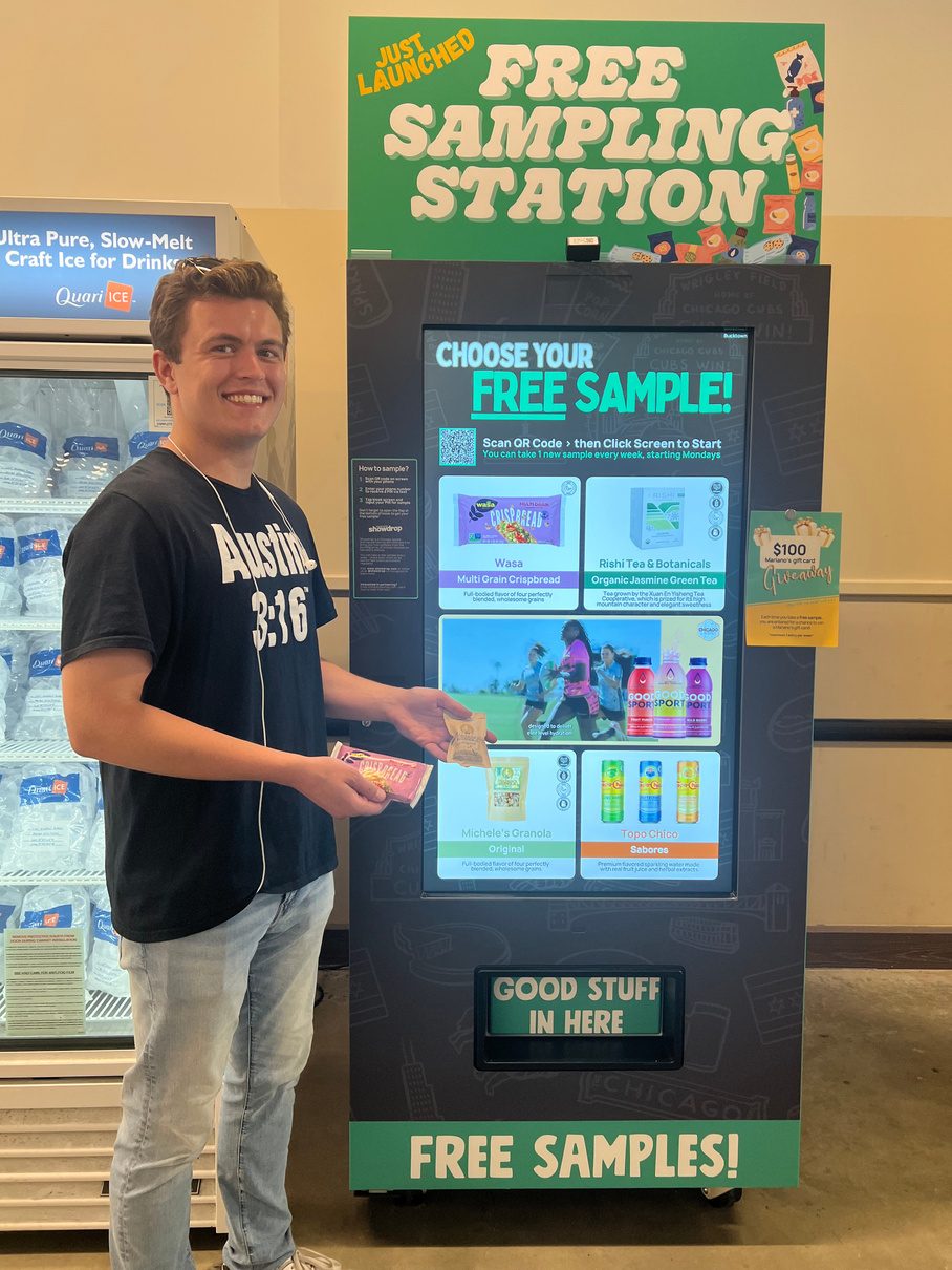 A shopper holding the sample he picked at the kiosk